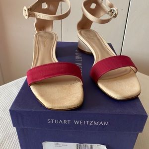 Tan with red stripe Stuart Weitzman sandals.